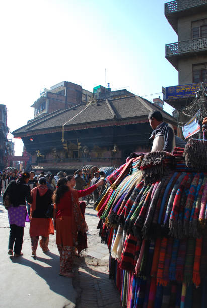 women buying the local produced wool shawl at the side of the road. - nepal bazaar kathmandu textile imagens e fotografias de stock