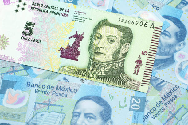 a five peso bank note from argentina with mexican twenty peso bank notes - argentina mexican pesos currency finance imagens e fotografias de stock
