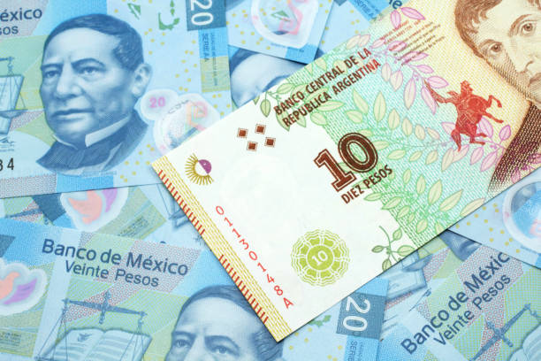 a ten peso bank note from argentina with mexican twenty peso bank notes - argentina mexican pesos currency finance imagens e fotografias de stock