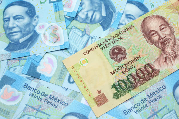 istock A Vietnamese dong bank note with Mexican twenty peso bank notes 1208949196