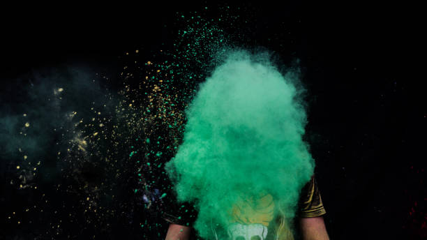 istock man celebrating holi with colors 1208951904