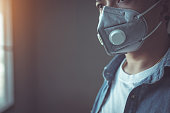 Man wearing a mask to protect against Coronavirus or Covid-19 virus And to prevent dust PM 2.5