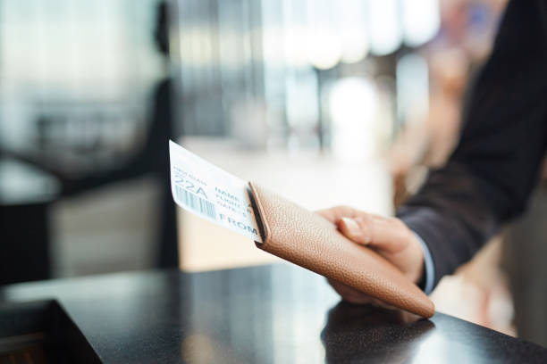 istock Hand Holding Passport And Flight Ticket 1208953319