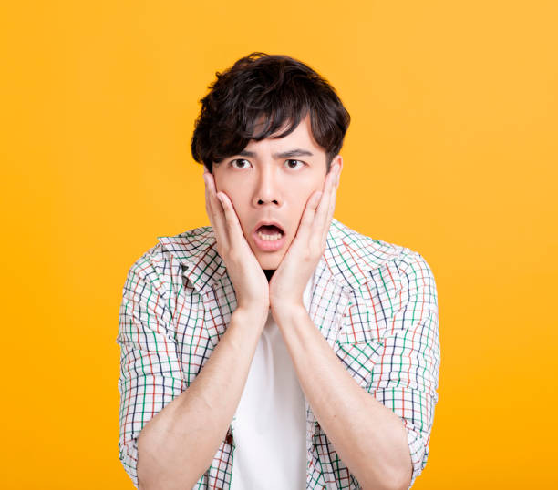 istock Closeup  of shocked and surprised young man 1208954632