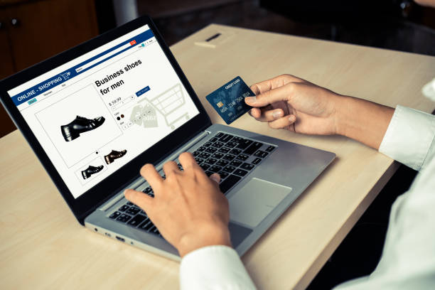 istock Young man use credit card for online shopping 1208961725