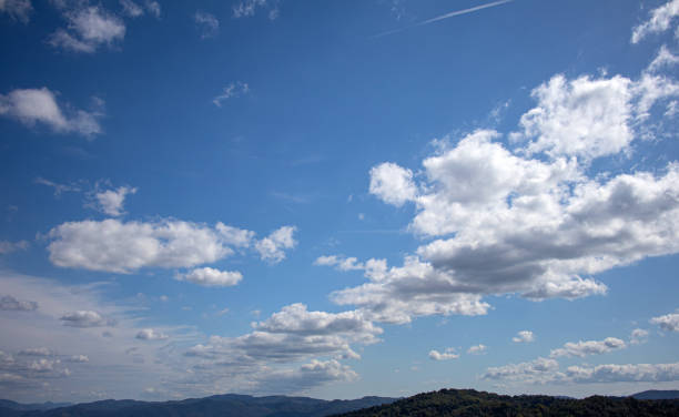 Blue sky with clouds beautiful mountains on background