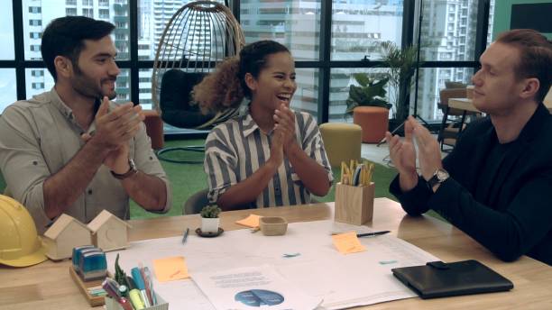 istock Creative business people group having conversation at office desk in workplace. 1208962102