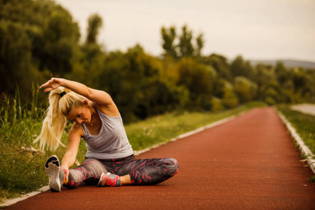 istock Woman stretching her body after going for a run 1208962245