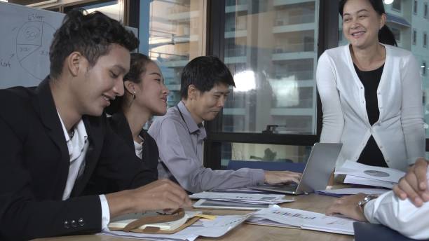istock Asian business people discuss marketing strategy. 1208962520