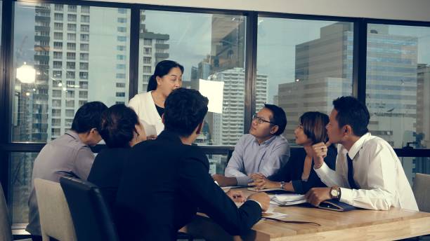 istock Asian business people discuss marketing strategy. 1208962633