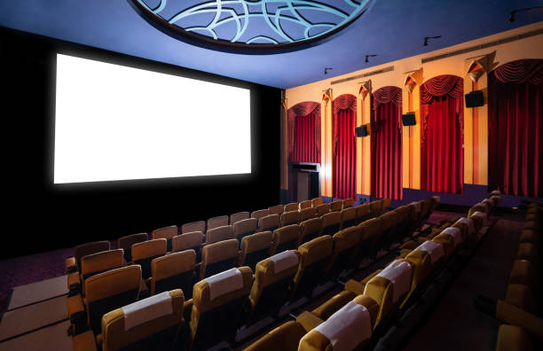 istock Cinema theater showing empty white movie screen. 1208963505