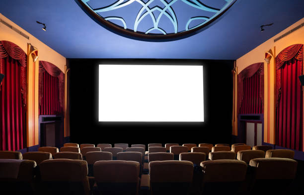 istock Cinema theater showing empty white movie screen. 1208963537