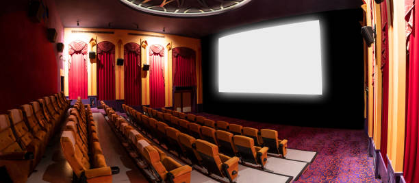 istock Cinema theater showing empty white movie screen. 1208963546