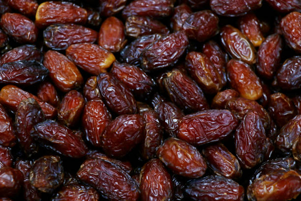 istock Fresh Medjool Dates background. Healthy organic product. Top view. Close up. 1208963926