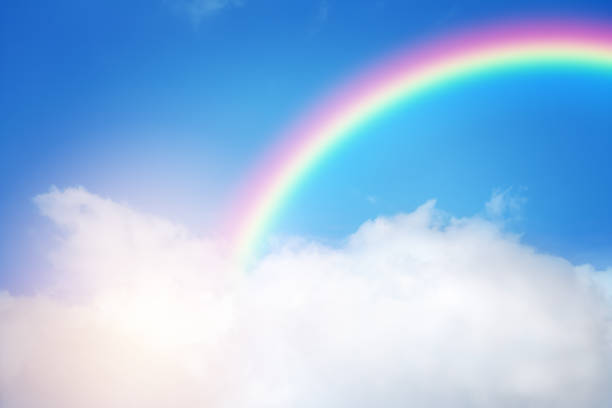 rainbow in cloudy sky texture of cloud with rainbow on blue sky spectrum photos stock pictures, royalty-free photos & images