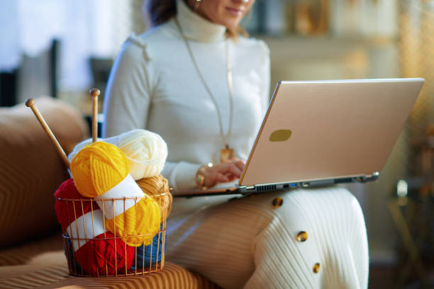 istock Closeup on elegant woman with yarn learn how to knit 1208978558