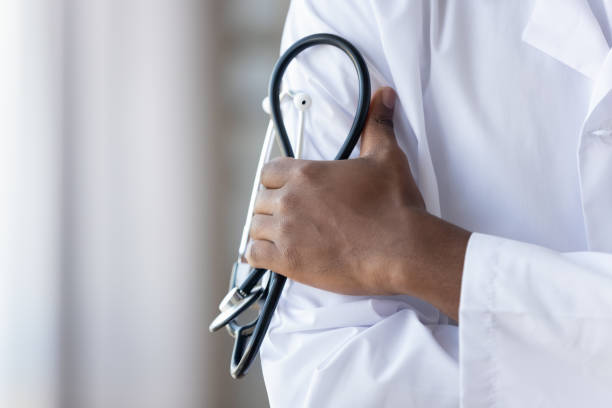 istock Close up african american young male doctors hands, holding phonendoscope. 1208979558