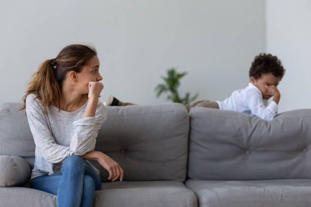 istock Unhappy young woman looking at stressed offended son. 1208979571