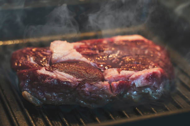 istock Steak cooking on griddle pan, searing meat 1208980709
