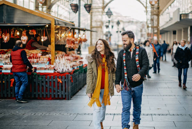 istock Young couple shopping for Christmas 1208982679