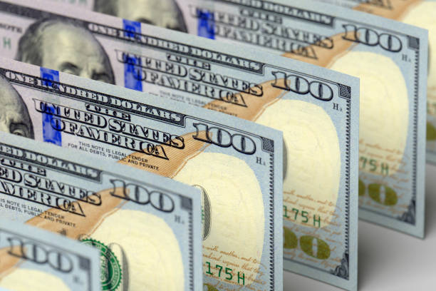 istock Money american dollars. One bill in focus 1208986022