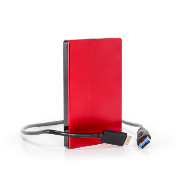 istock External hard drive disc with usb 3.0 cable. Best way of data storage on portable hdd. Close up right view isolated on white background. 1208986267