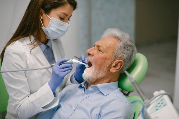 istock Senior man at the dentist 1208991431
