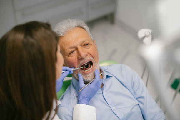 istock Senior man at the dentist 1208991862