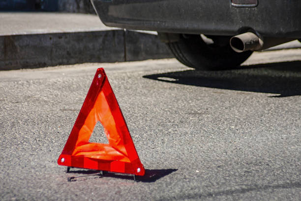 istock Emergency stop sign placed in front of colliding vehicles 1208992419