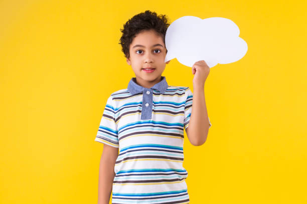 istock Black ethnicity child boy isolated on yellow background 1208993431