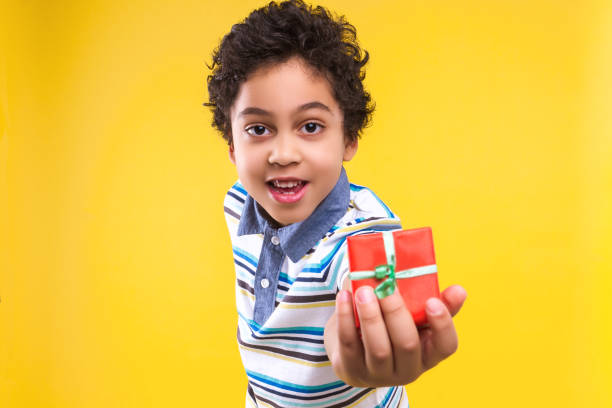 istock Black ethnicity child boy isolated on yellow background 1208993680