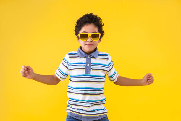 istock Black ethnicity child boy isolated on yellow background 1208993768