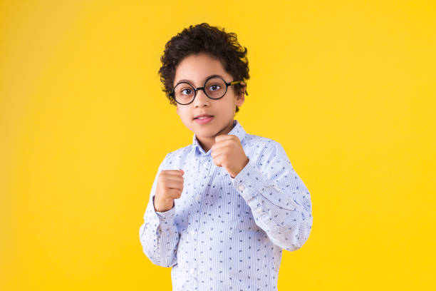 istock Black ethnicity child boy isolated on yellow background 1208993982