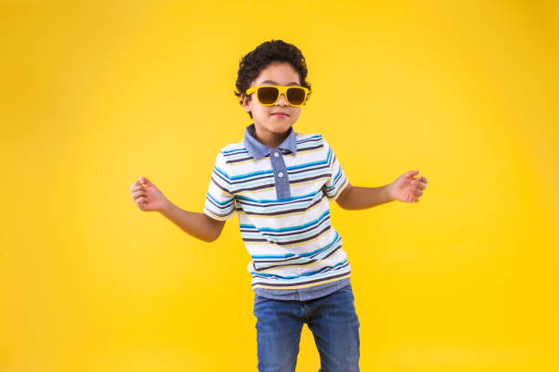 istock Black ethnicity child boy isolated on yellow background 1208994942