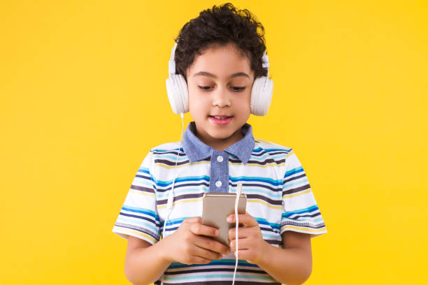 istock Black ethnicity child boy isolated on yellow background 1208995050
