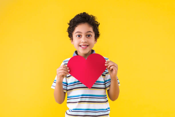 istock Black ethnicity child boy isolated on yellow background 1208995230