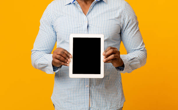 istock Digital tablet with blank screen in hands of african man 1208995262