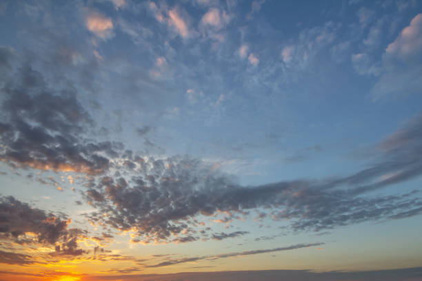 istock Sunset sky covered with orange puffy clouds in the evening. 1208998042