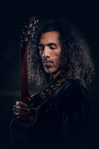 istock Portrait of talented singer with his guitar 1209001029