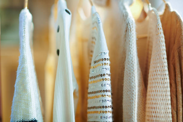 istock Closeup on clothes on hangers 1209004441