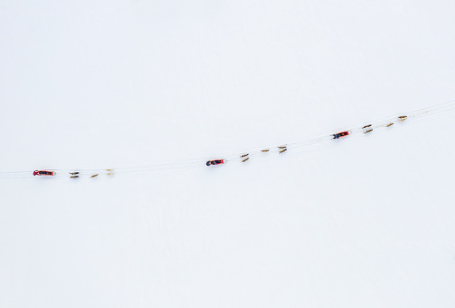 aerial view of Dogsledding in the snowcapped mountains of Norway