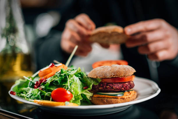 istock Chef Making Vegan Burgers in a Restaurant Kitchen 1209006214