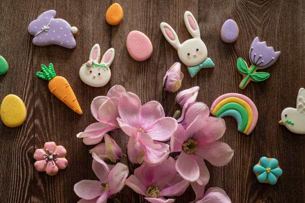 istock Happy Easter. Multi-colored pastel easter cookies on a wooden background 1209006342