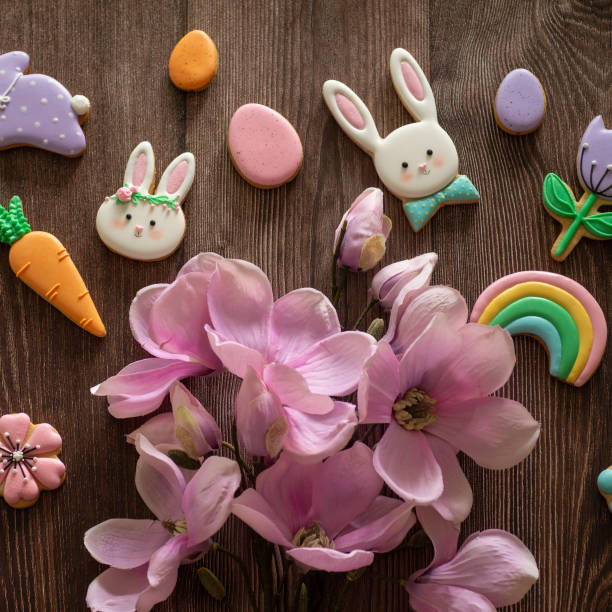 istock Happy Easter. Multi-colored pastel easter cookies on a wooden background 1209006478