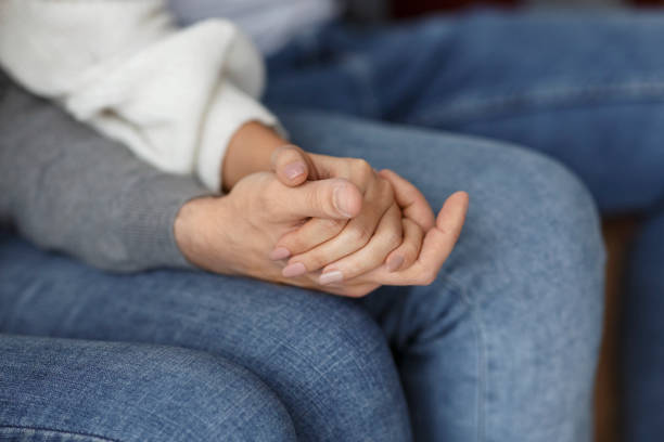 istock Spouses Holding Hands Supporting Each Other Sitting Indoor, Cropped 1209007043