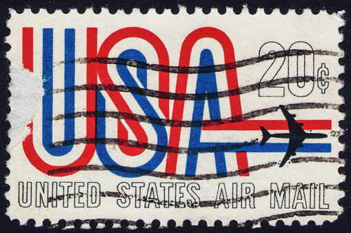 Stamp issued in the United States with the inscription USA and the image of a jet plane