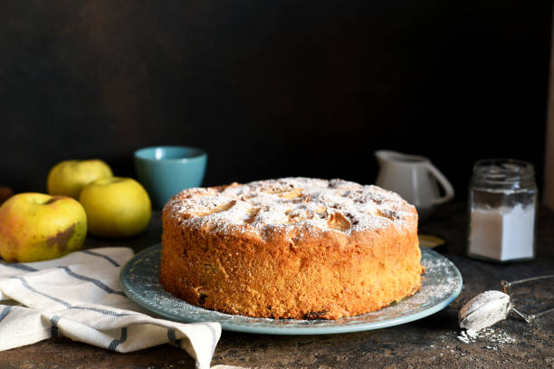 istock Charlotte - a classic pie with apples on a concrete background. 1209008285