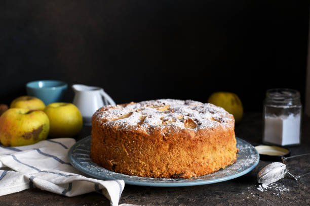 istock Charlotte - a classic pie with apples on a concrete background. 1209008313