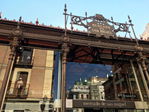 Madrid, Spain - February 23, 2020: View of the upper section of the famous Mercado de San Miguel in the city downtown. This is a covered market originally built in 1916. This is the most popular market in Madrid among tourists since it is located in the city center, within walking distance from Plaza Mayor. The market is not a traditional grocery market but a gourmet tapas market