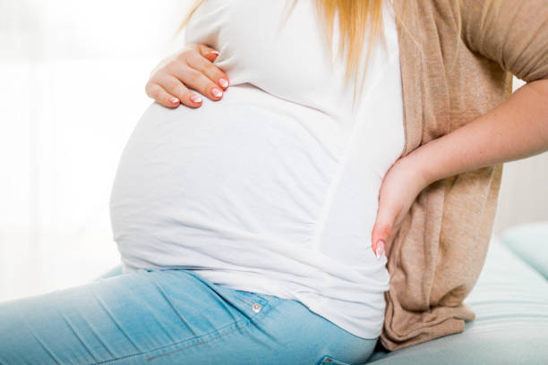 istock Lower back pain, discomfort during pregnancy 1209008719